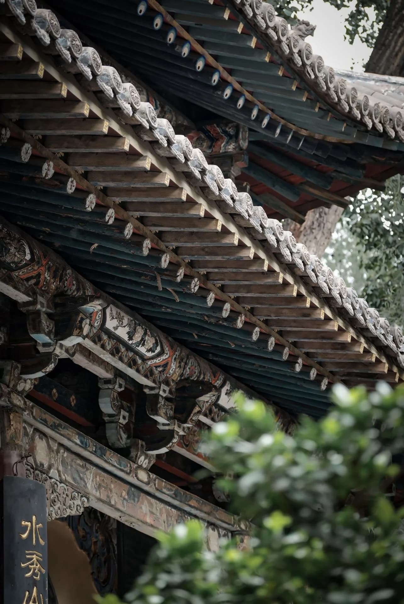 Painted timber brackets and architectural details at Jinci in Shanxi